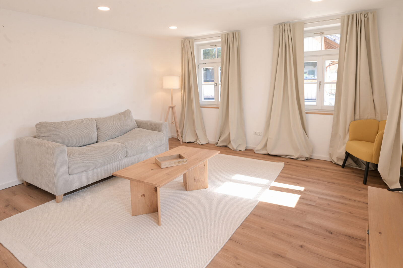 After: the same living room, professionally photographed
